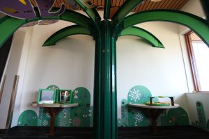 large apple and interactive exhibit for library